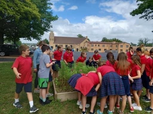 4th graders checking out the butterfly garden they planted last year.