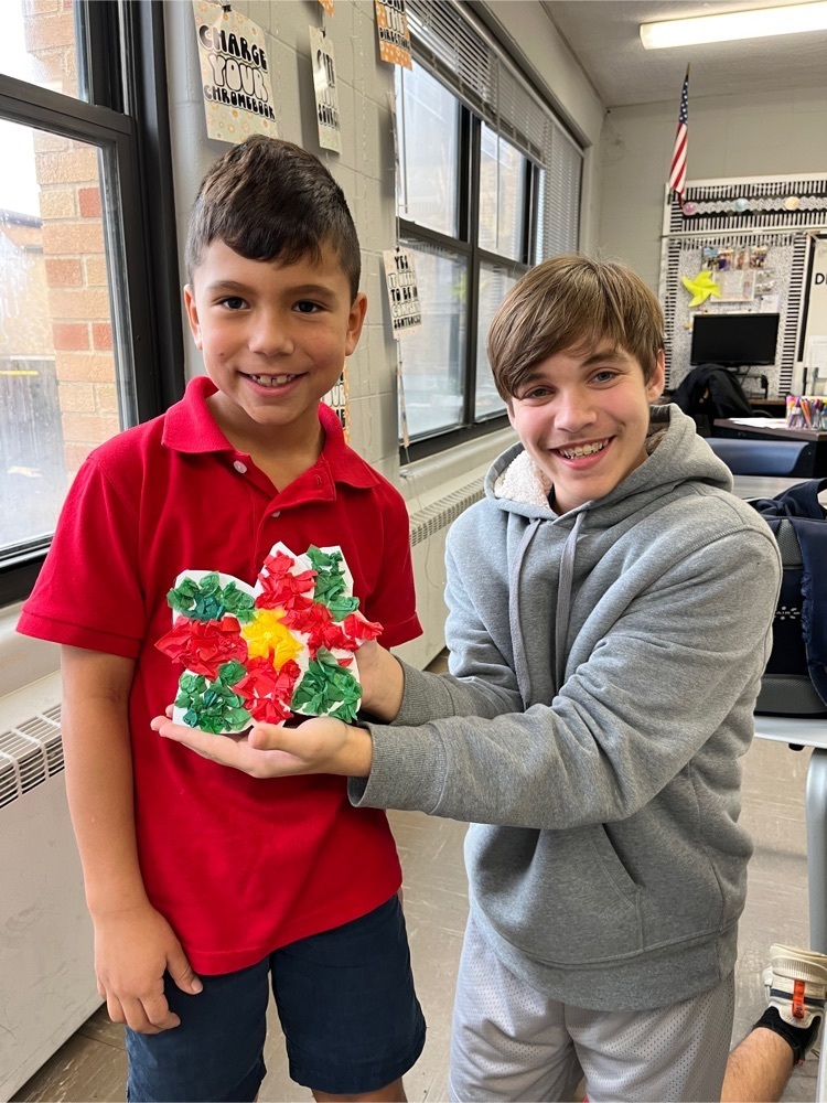 The 1st graders have been busy traveling the world! They have been to Australia, India, and even Italy! The 7th grade joined them today as they traveled to Mexico. We watched/listened to “The Legend of the Poinsettia” and made our poinsettia craft.  